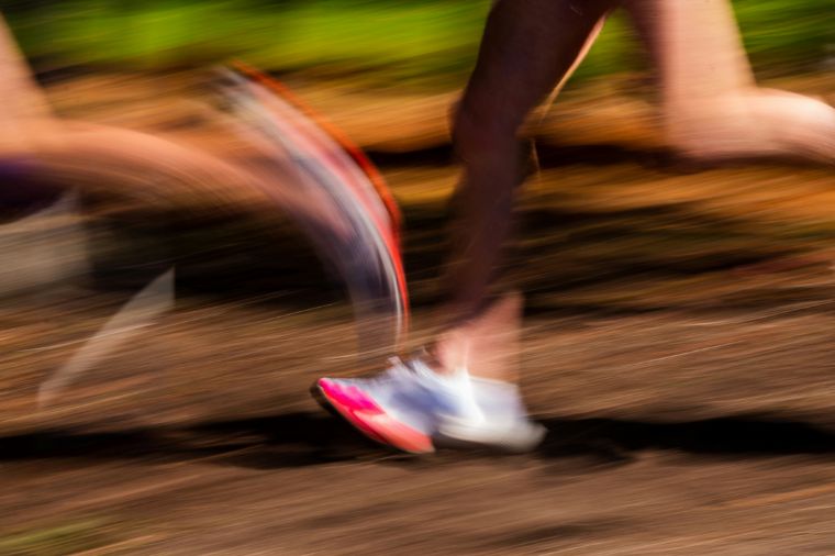 Blurry running legs showing sports records that will never be broken.
