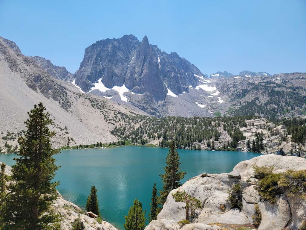 10 best Hiking Trails in the World best hiking trails in the world 1 Hiker overlooking Big Pine Lakes in California’s Sierra Nevada mountains, one of the best hiking trails in the world